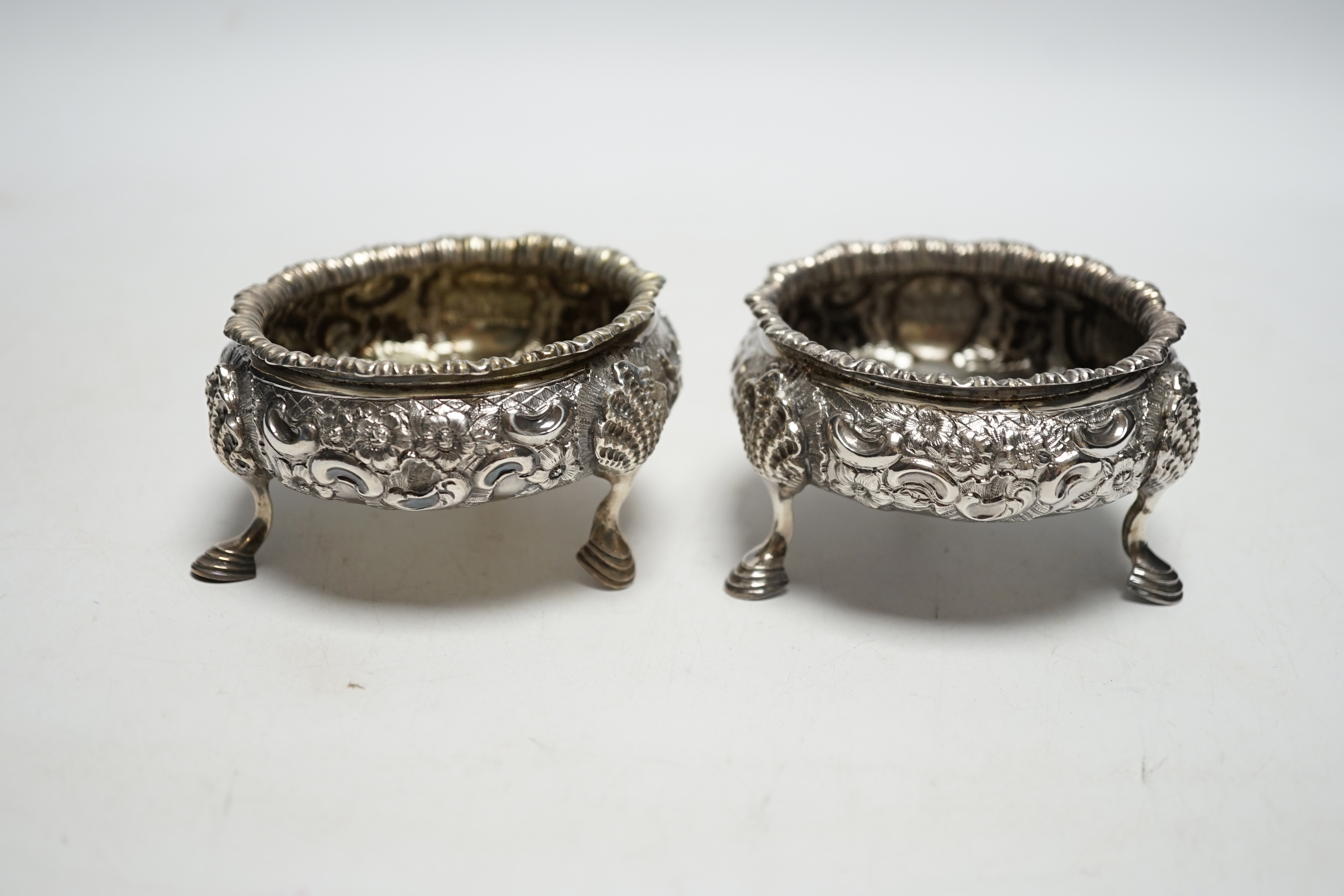 A pair of Victorian embossed silver bun salts, London, 1848, diameter 75mm.